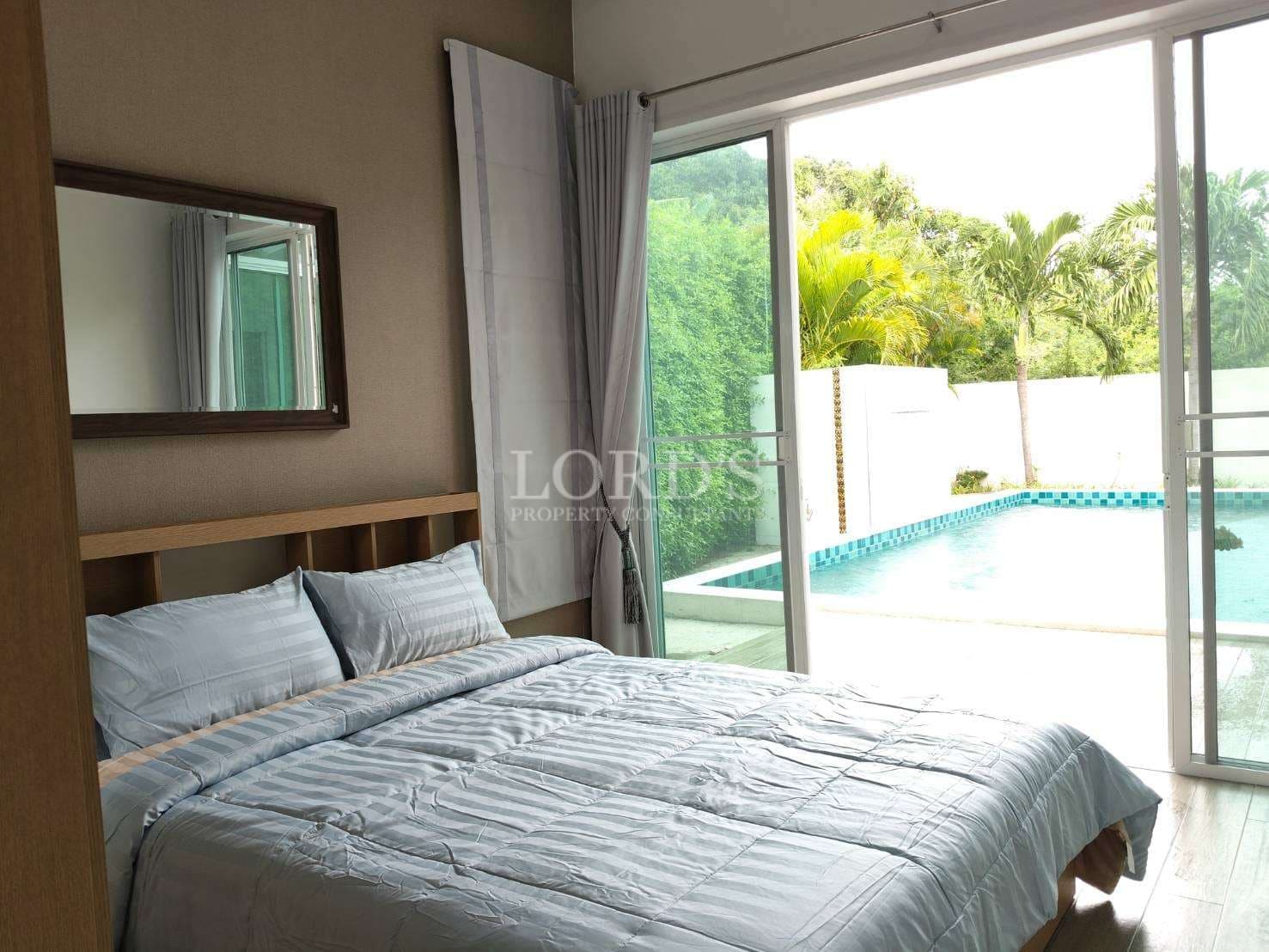 Modern bedroom with pool view