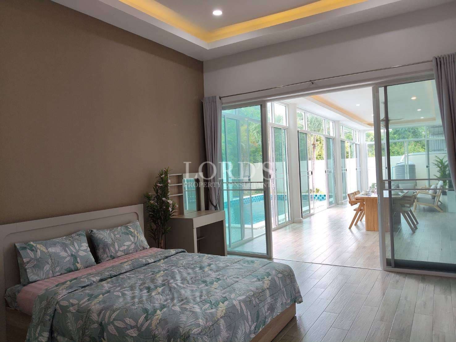 Modern bedroom with pool view