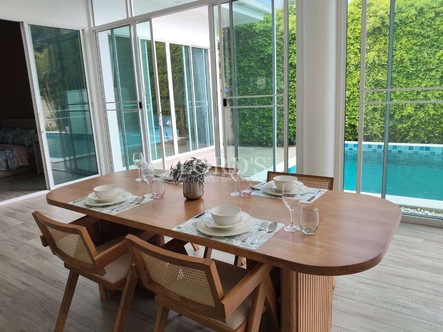 Modern dining area by the pool