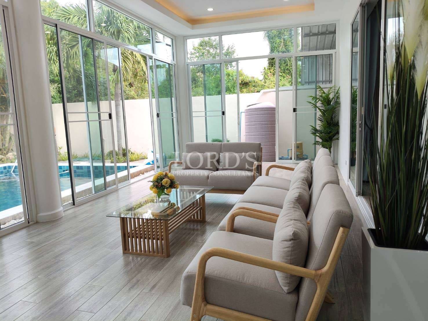 Modern living room with pool view