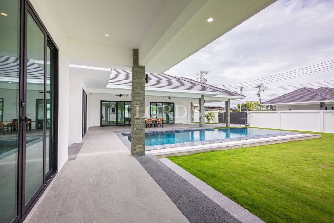 Modern house with pool and lawn