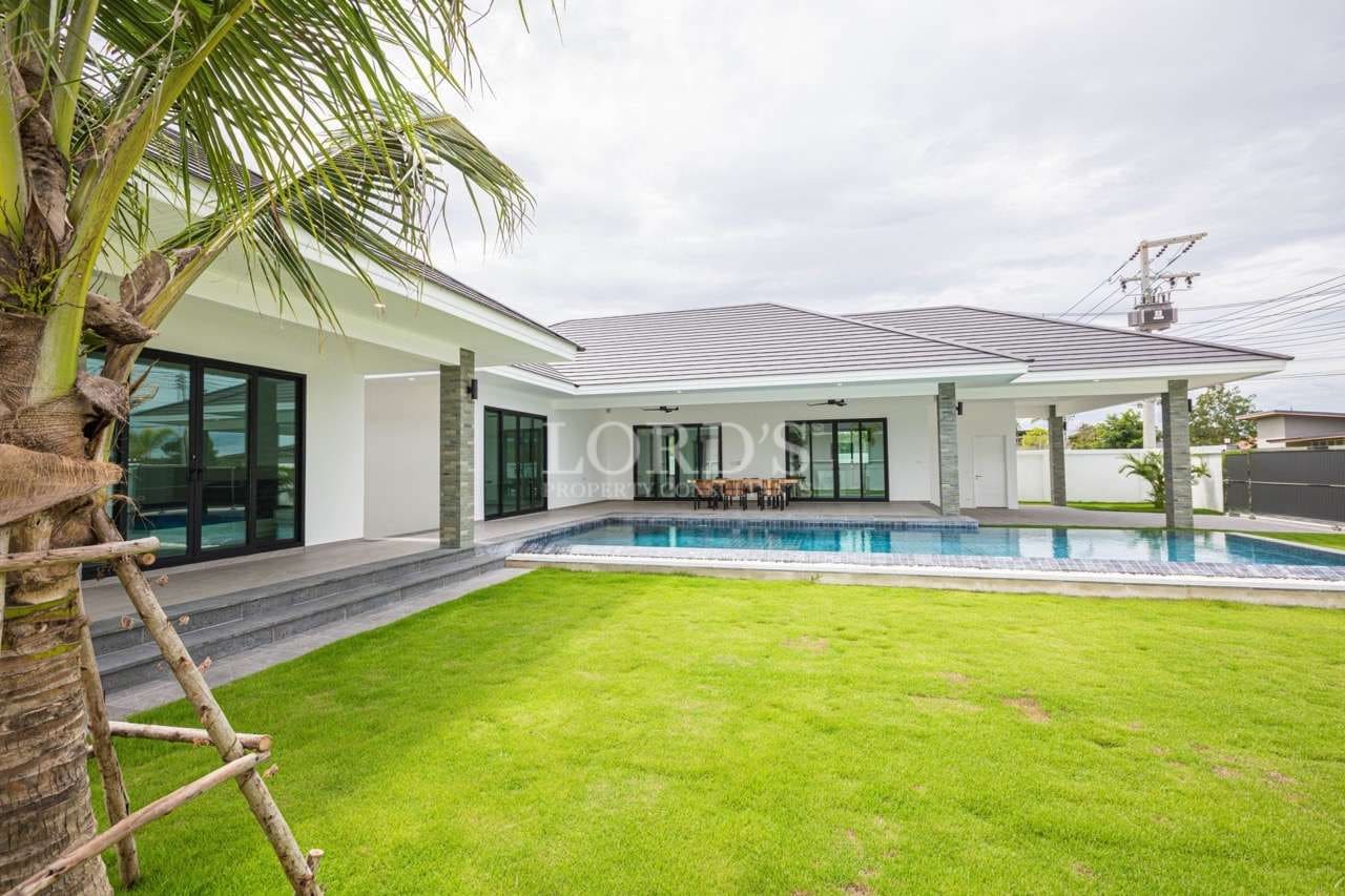 Modern house with pool and lawn