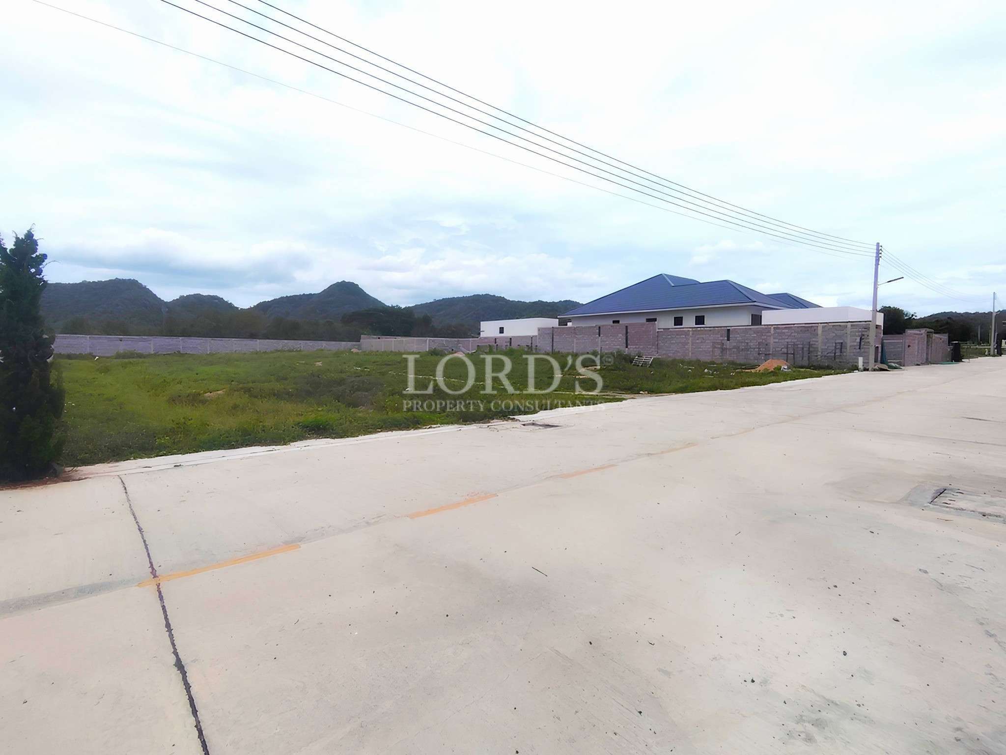Empty lot with distant mountains