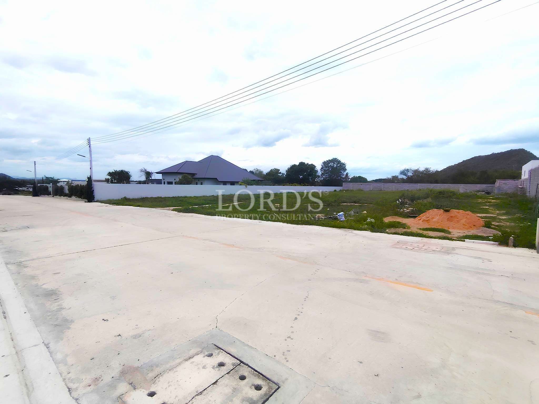 Empty lot with cloudy sky
