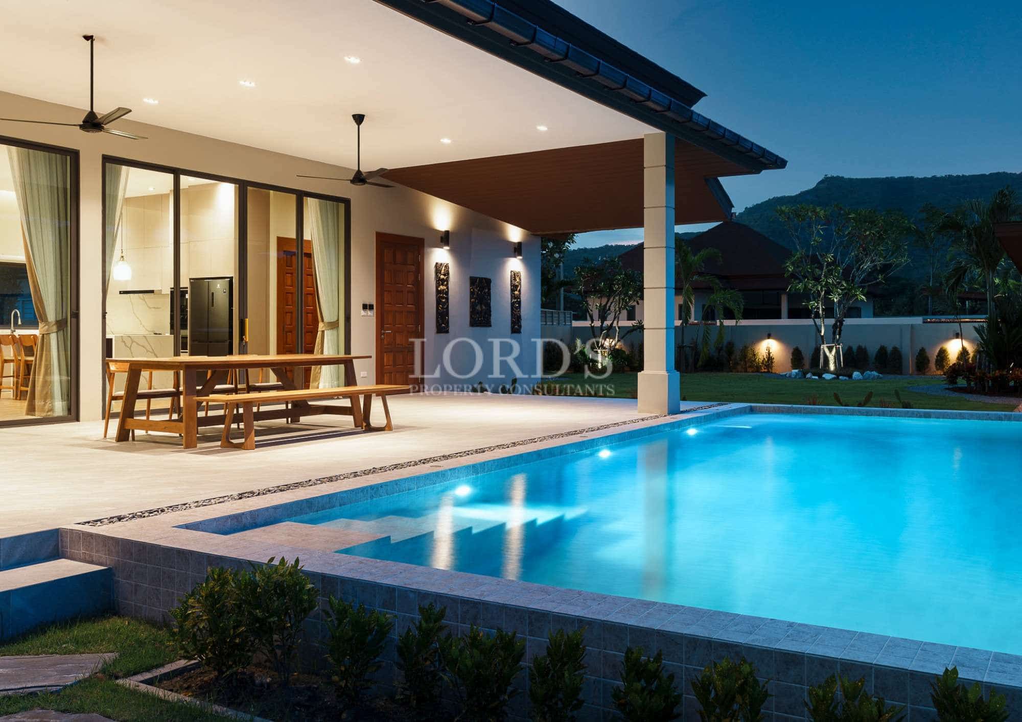 Modern house with pool at night