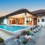 Modern house with pool at sunset