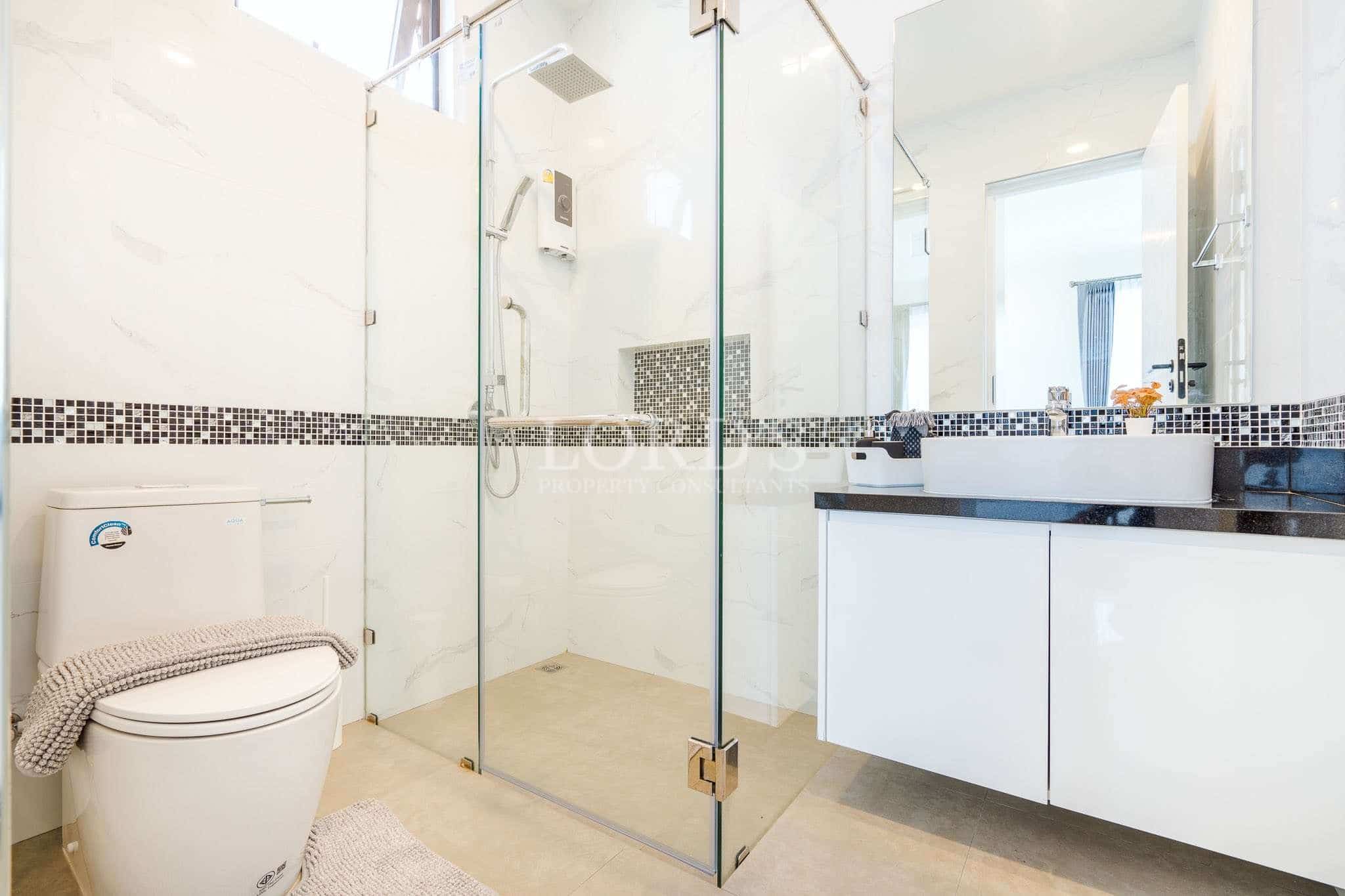 Modern bathroom with glass shower.