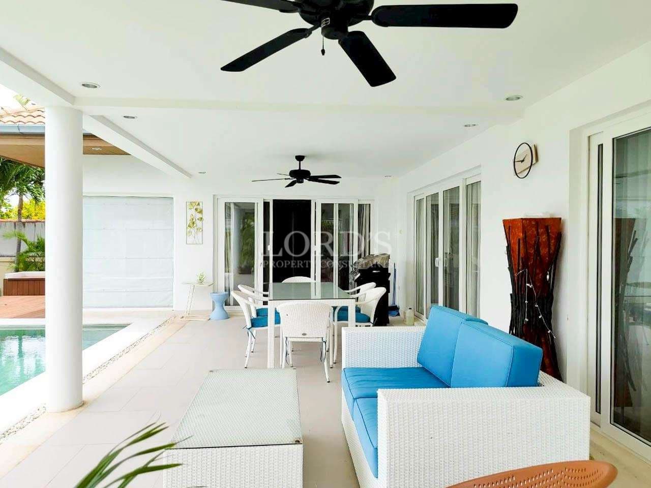 Modern patio with poolside furniture