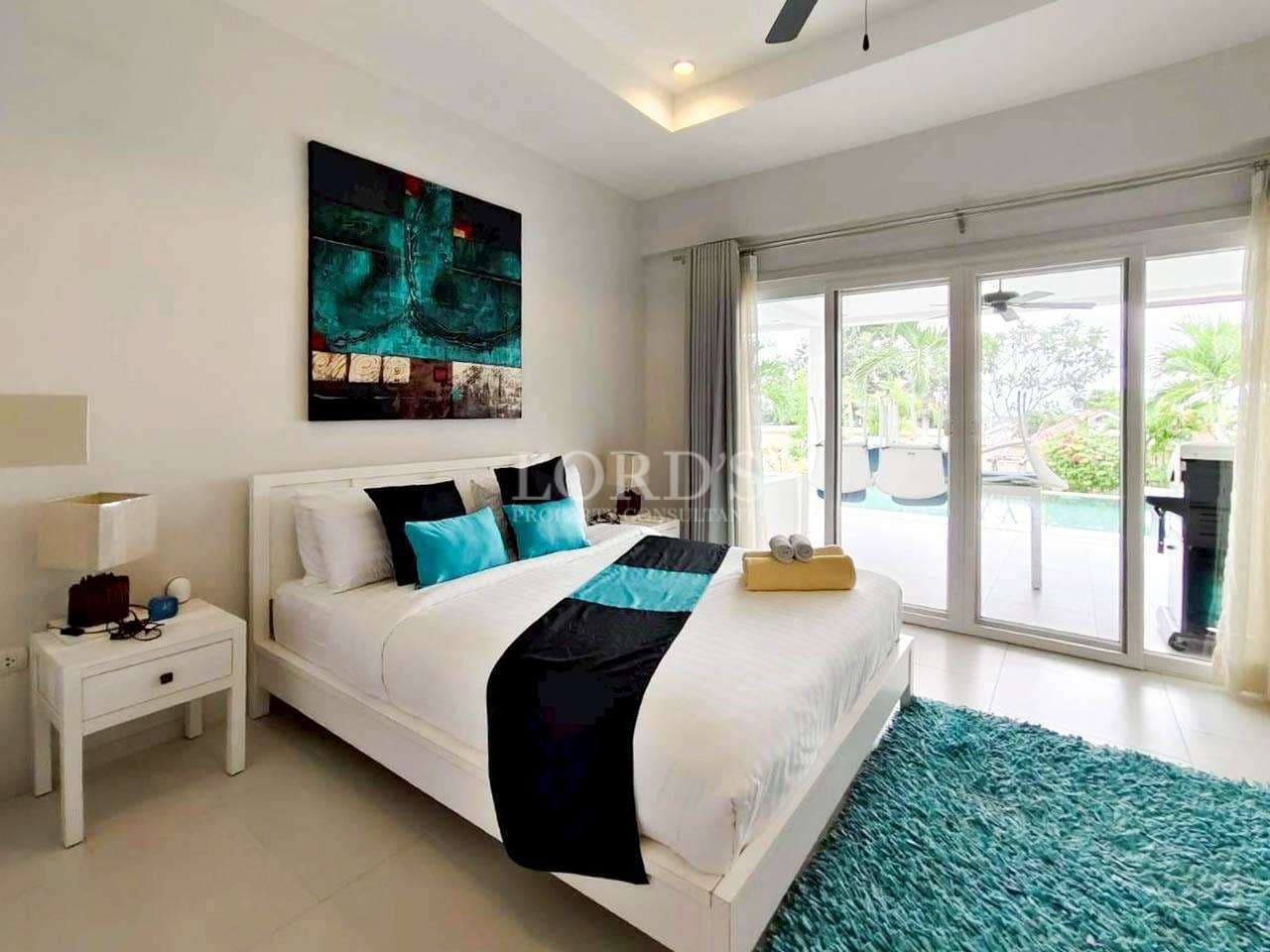 Modern bedroom with pool view