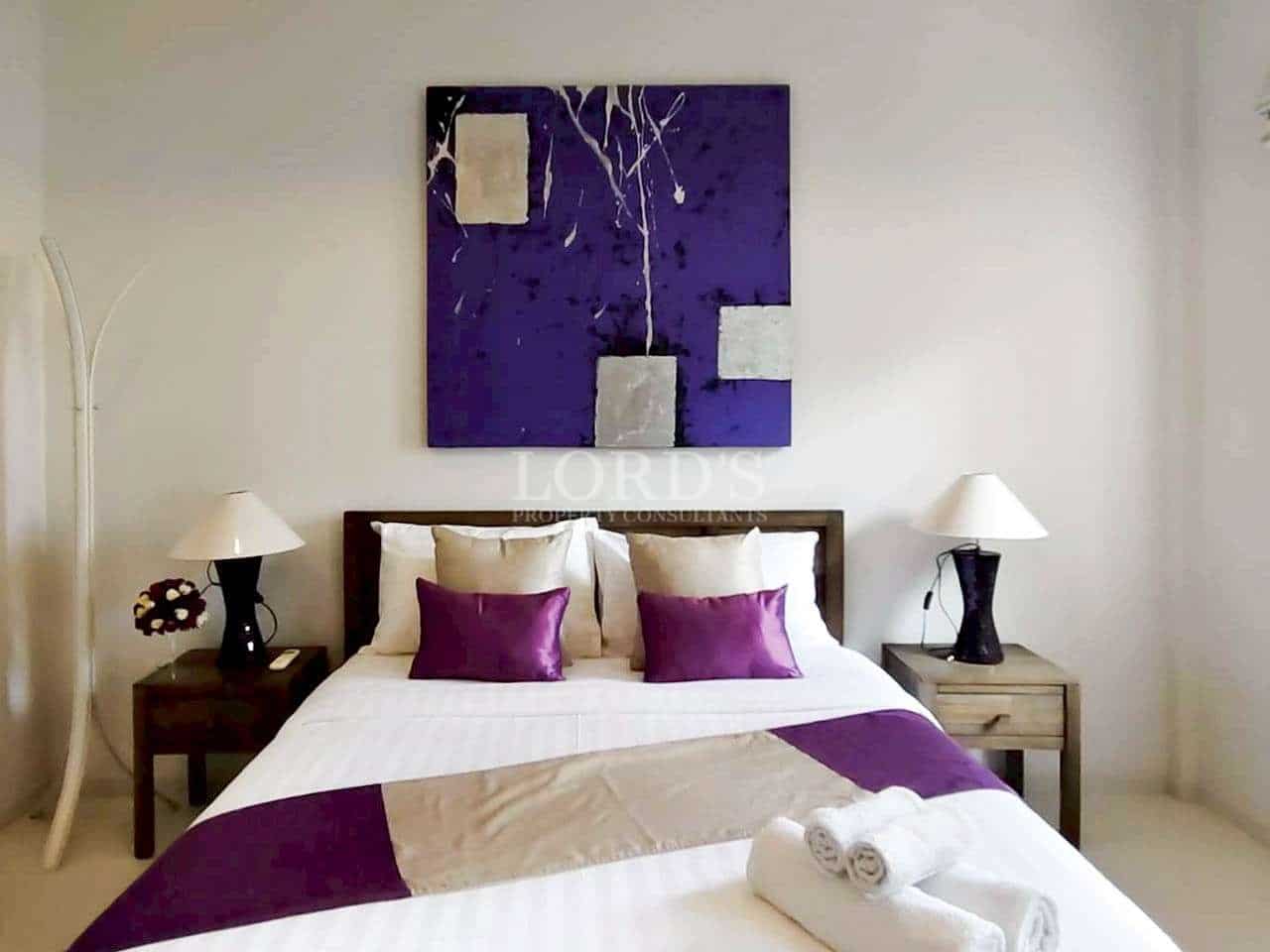Modern bedroom with purple accents