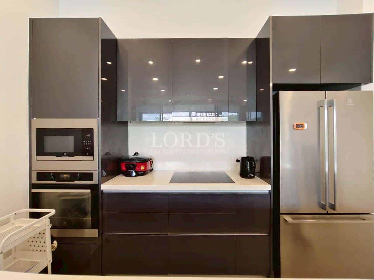 Modern kitchen with sleek appliances.