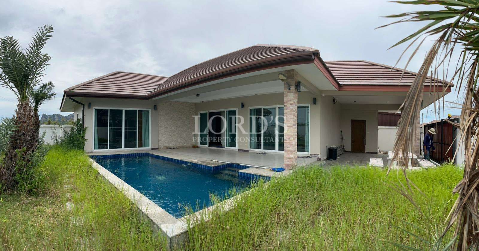 Modern house with pool and greenery