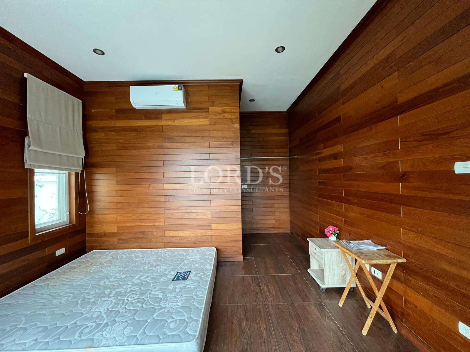 Empty room with wooden walls