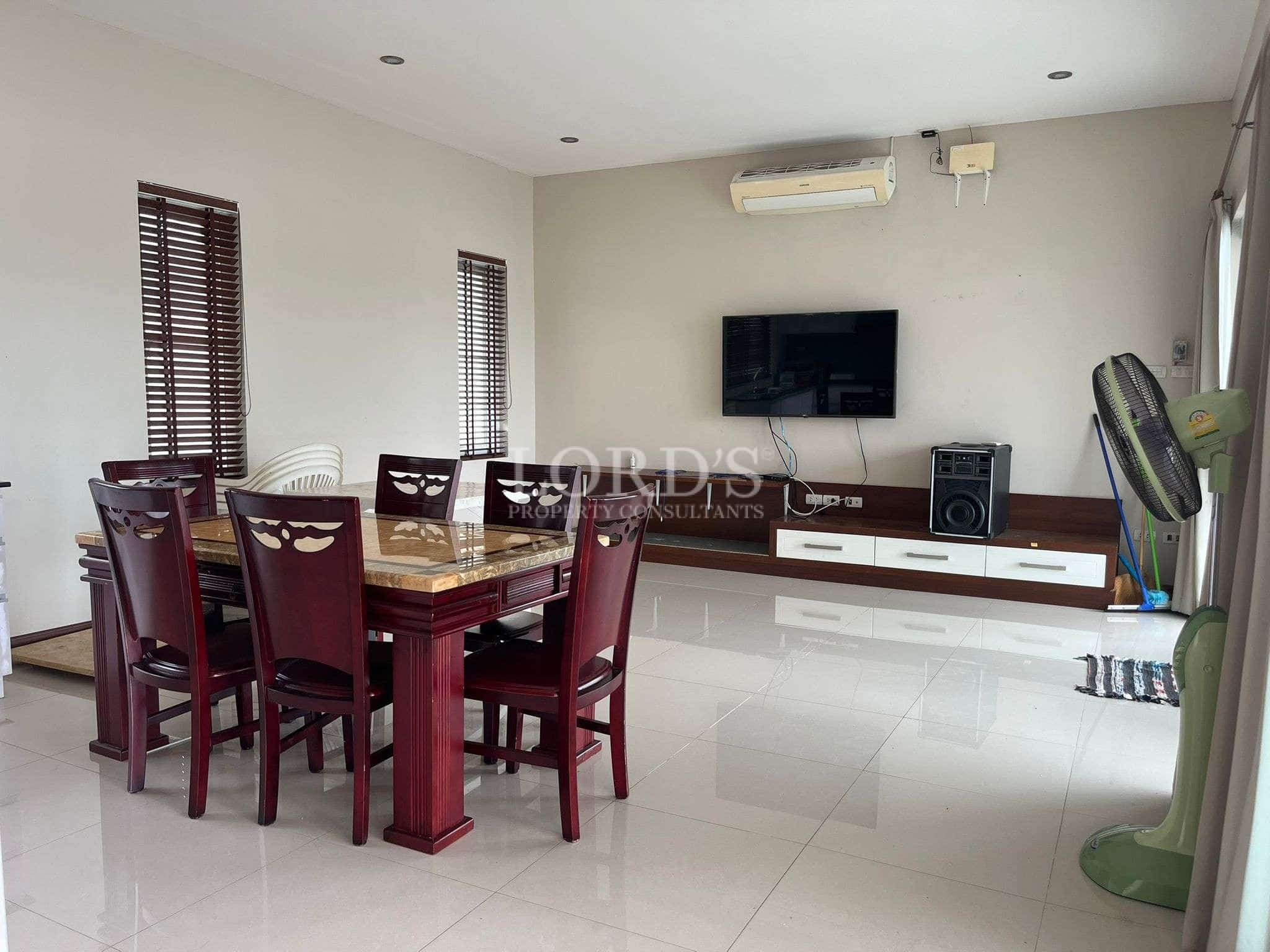 Modern dining area with television