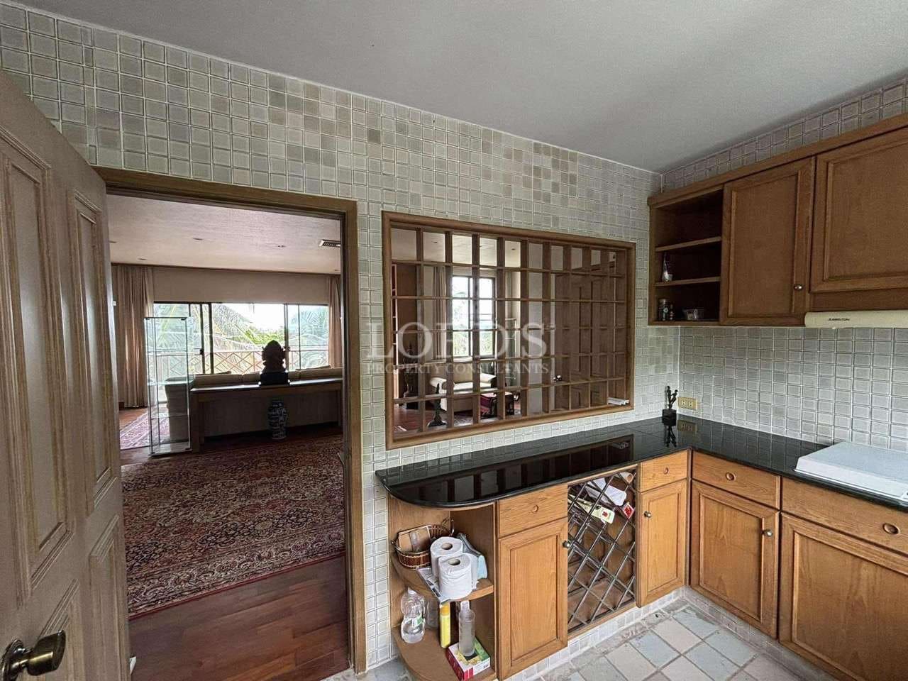 Cozy kitchen with wooden cabinets.