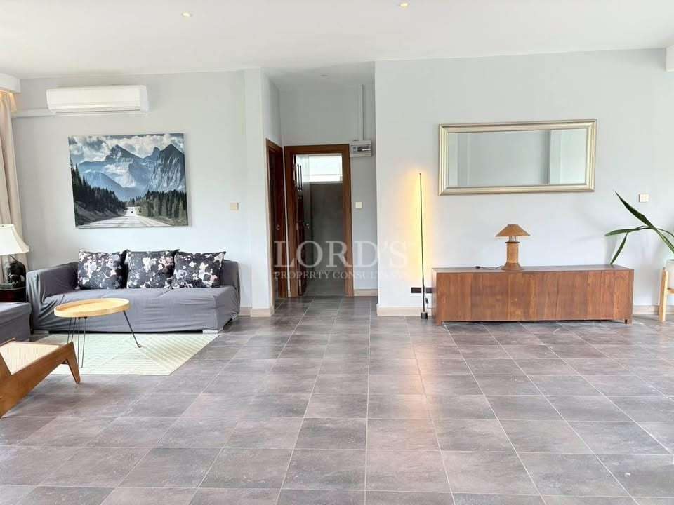 Spacious, modern living room interior.