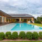 Modern villa with pool and greenery