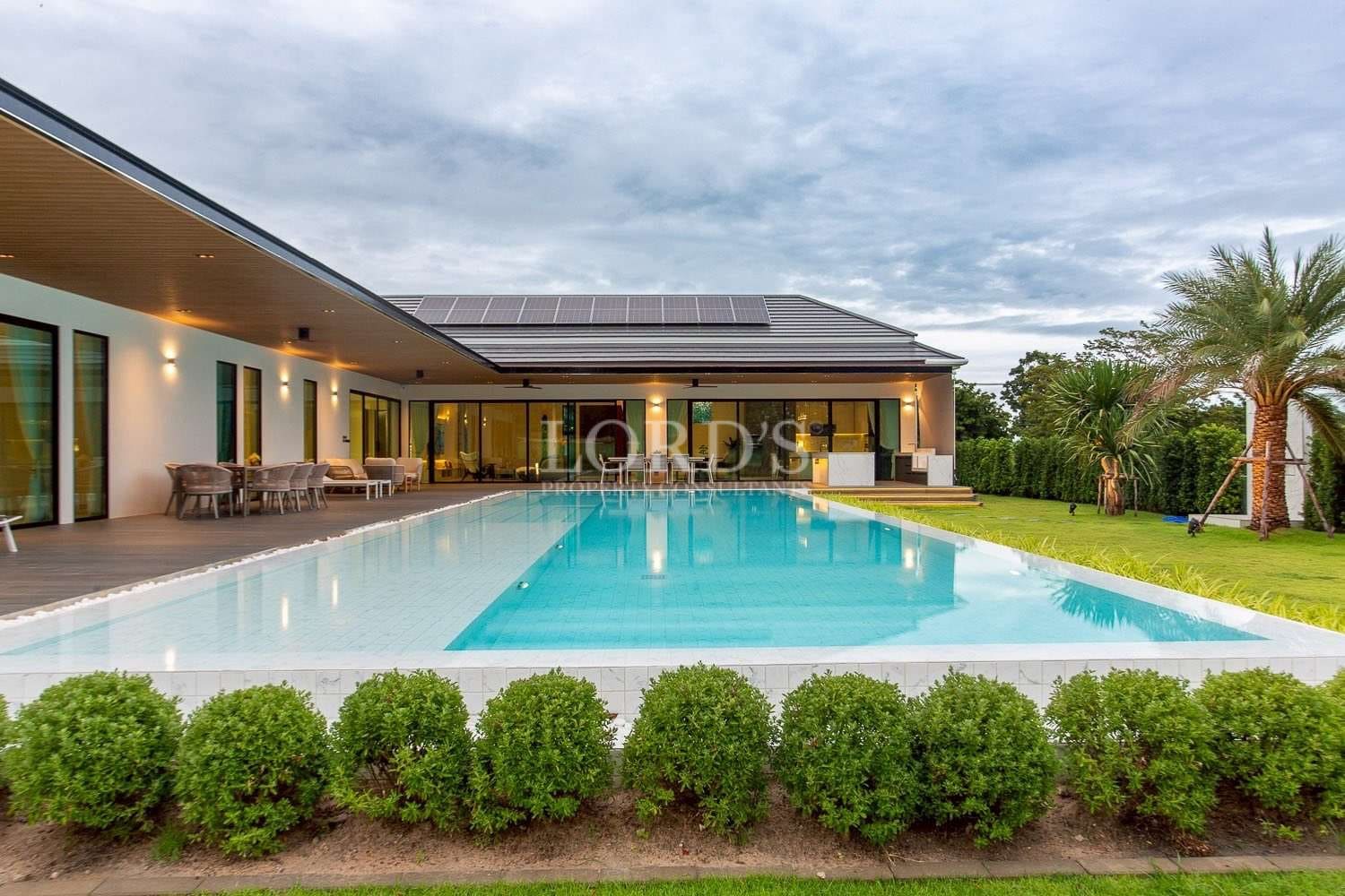 Modern villa with pool and greenery