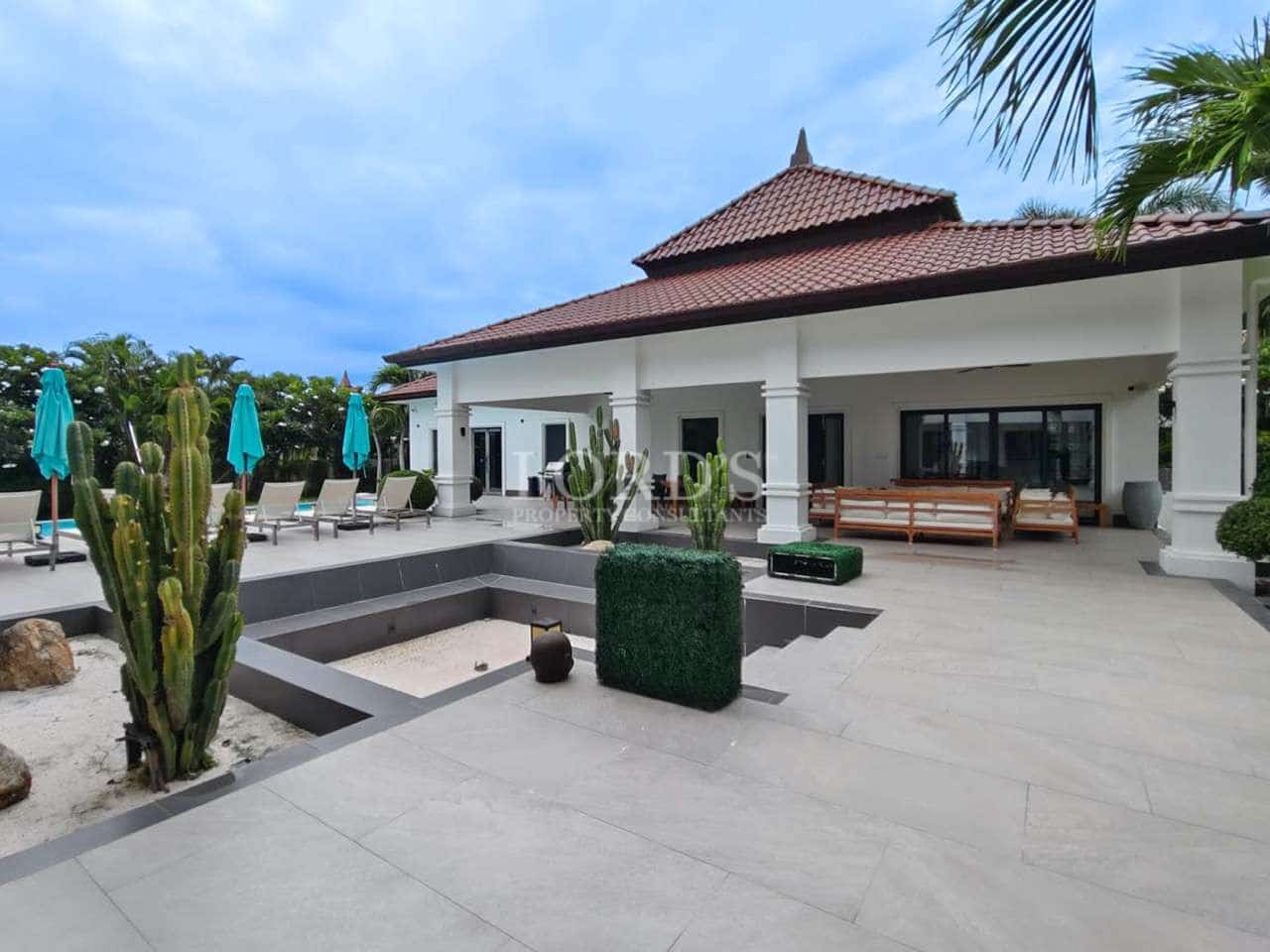 Modern villa with poolside seating