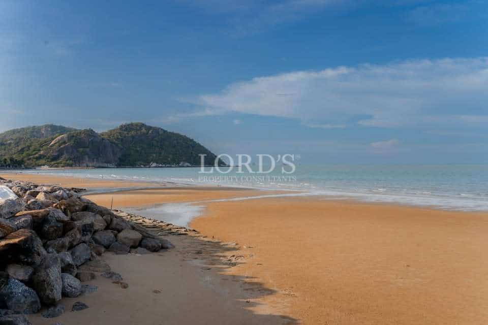 Serene beach with rocky shoreline