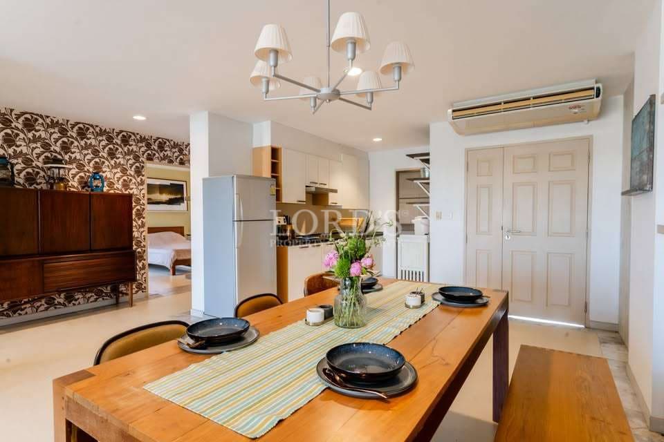 Modern dining area with floral wallpaper