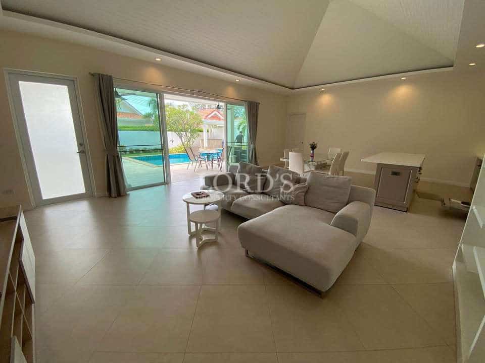 Modern living room with pool view