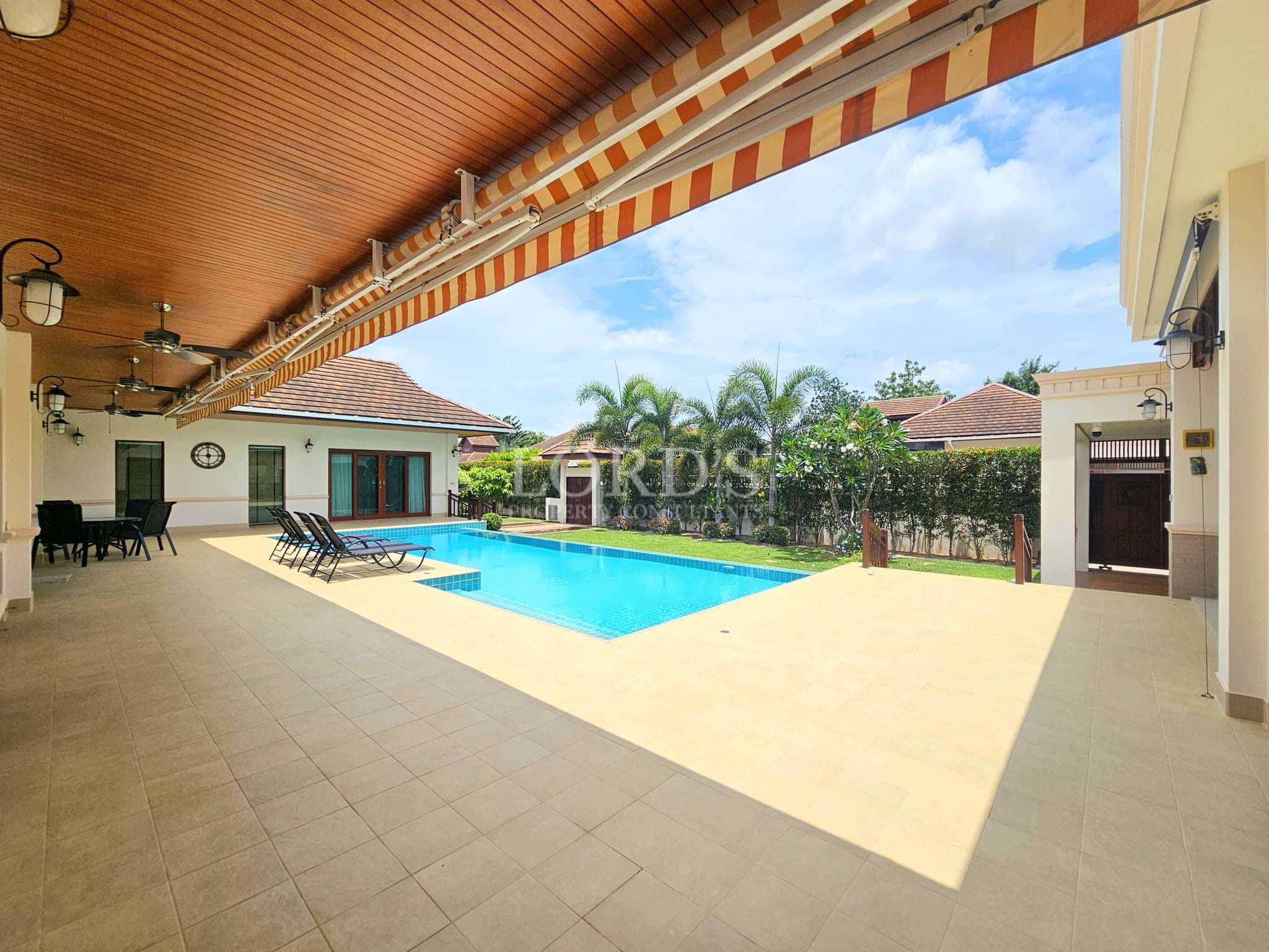 Covered pool terrace with private swimming pool and outdoor seating area