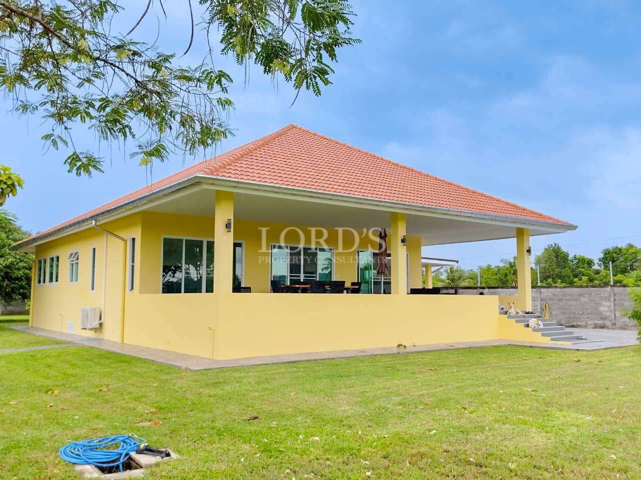 Yellow house with red roof