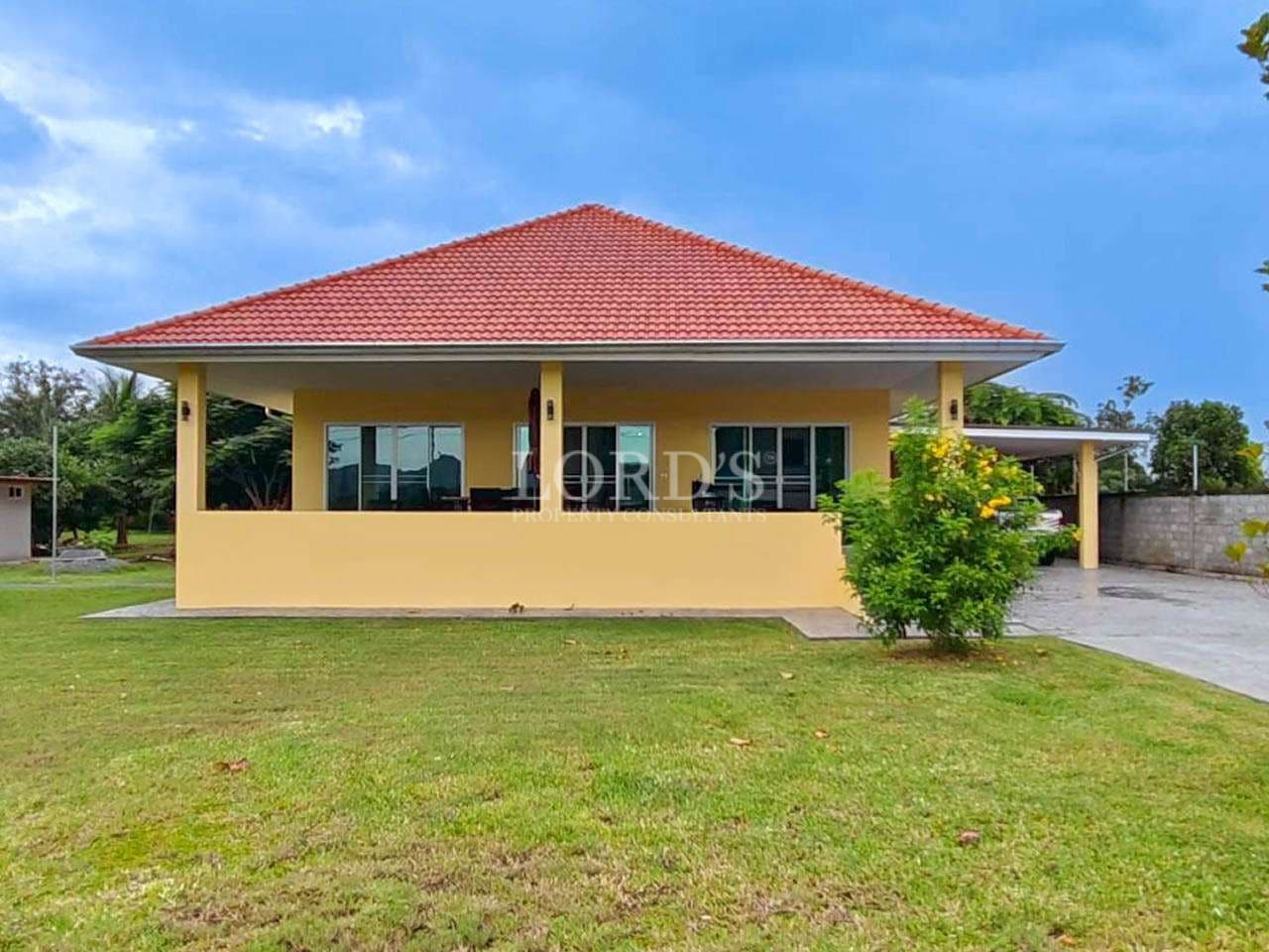 Single-story house with green lawn