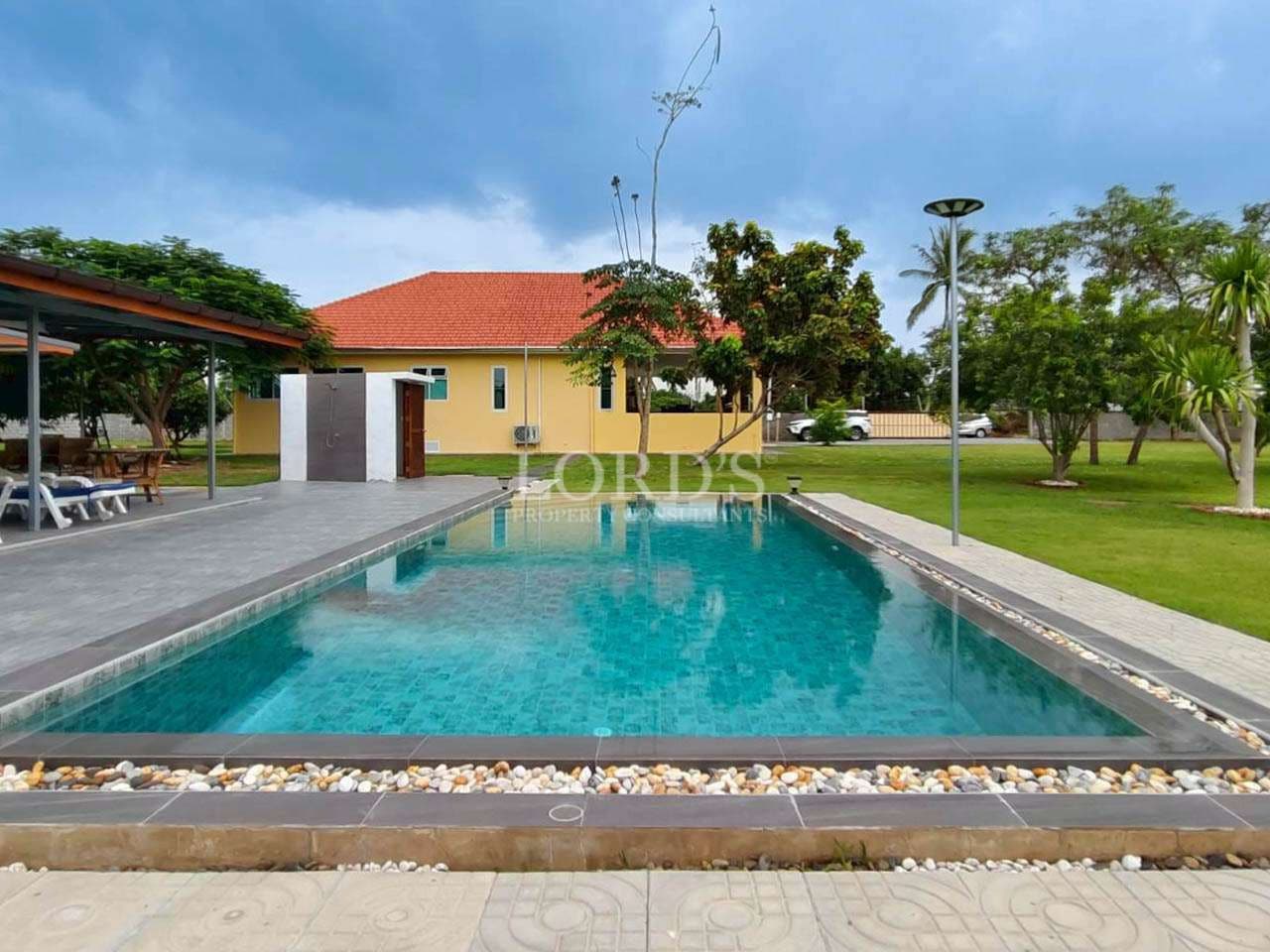 Serene poolside with lush greenery