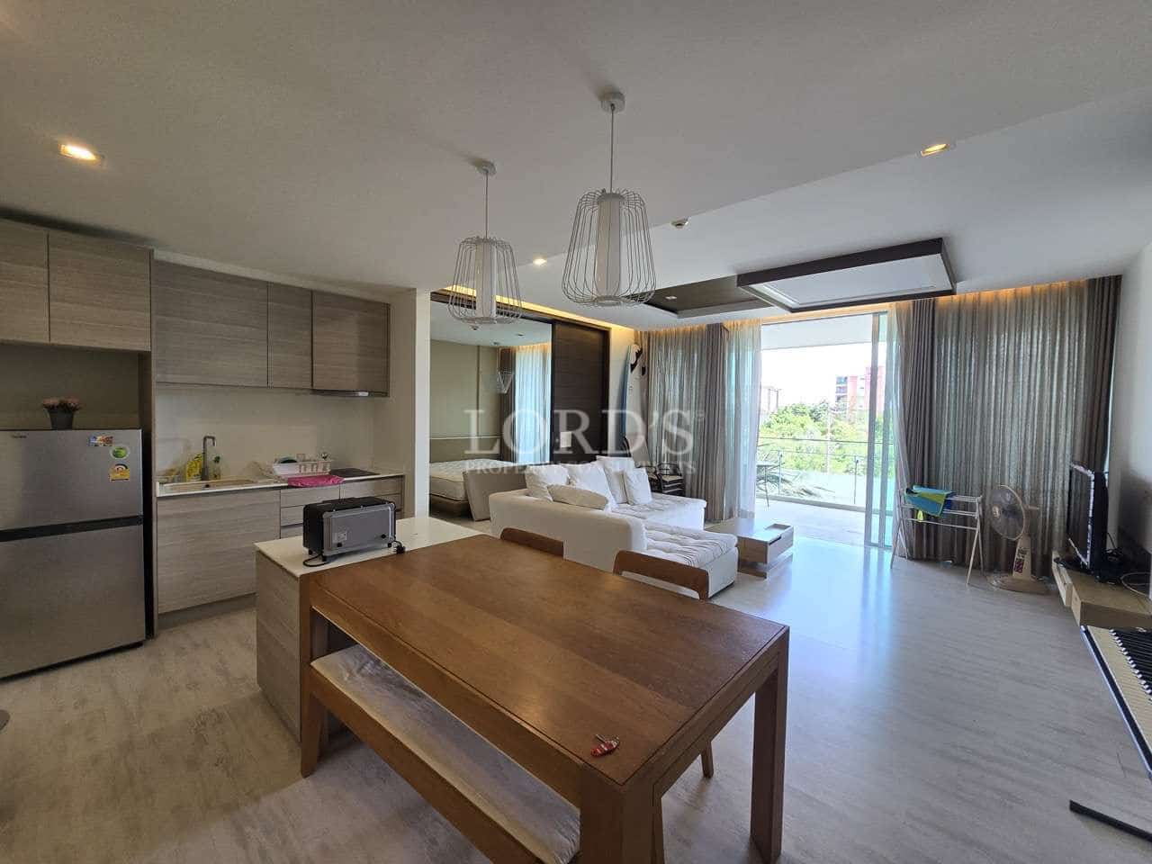 Modern living room with kitchen area