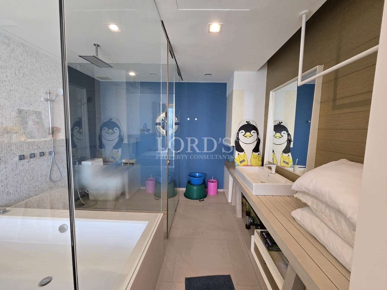 Modern bathroom with penguin decorations.