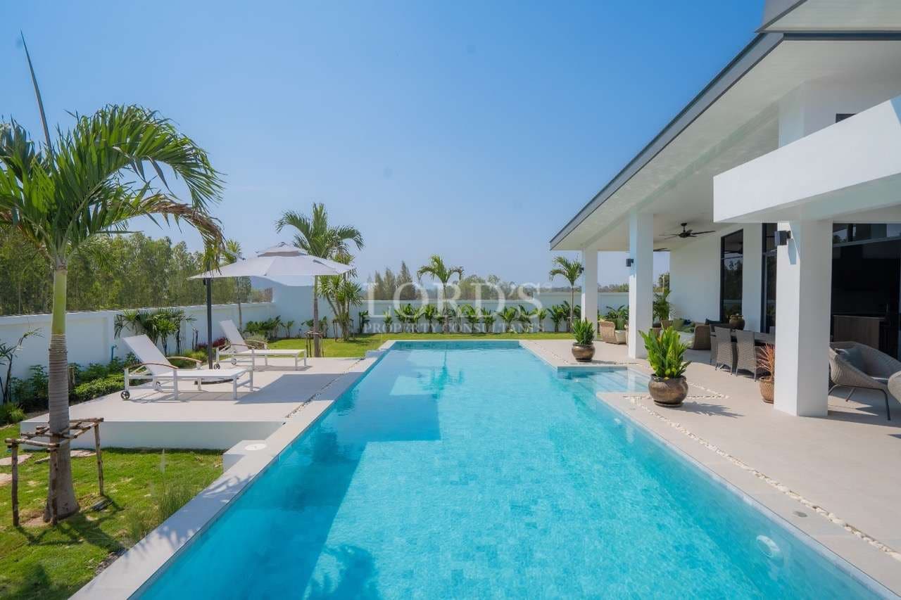 Luxurious poolside with tropical surroundings