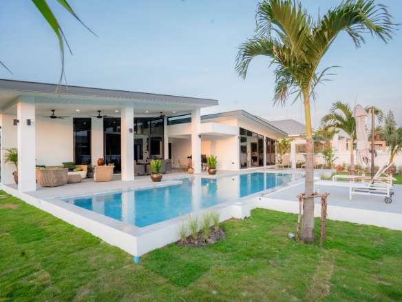Modern house with pool and palm