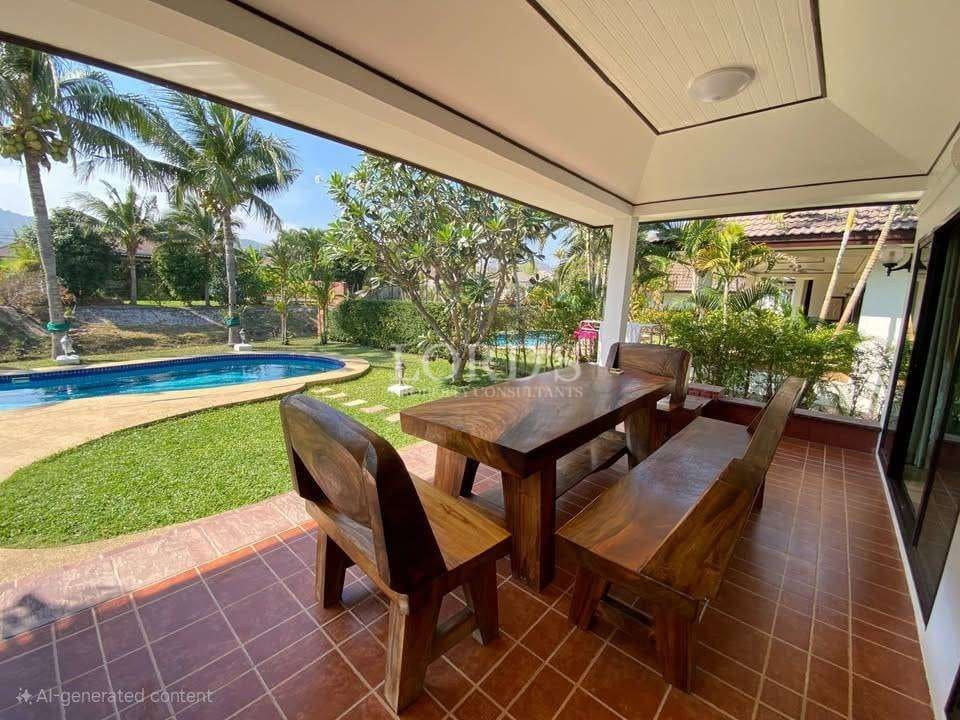 Outdoor dining area by pool