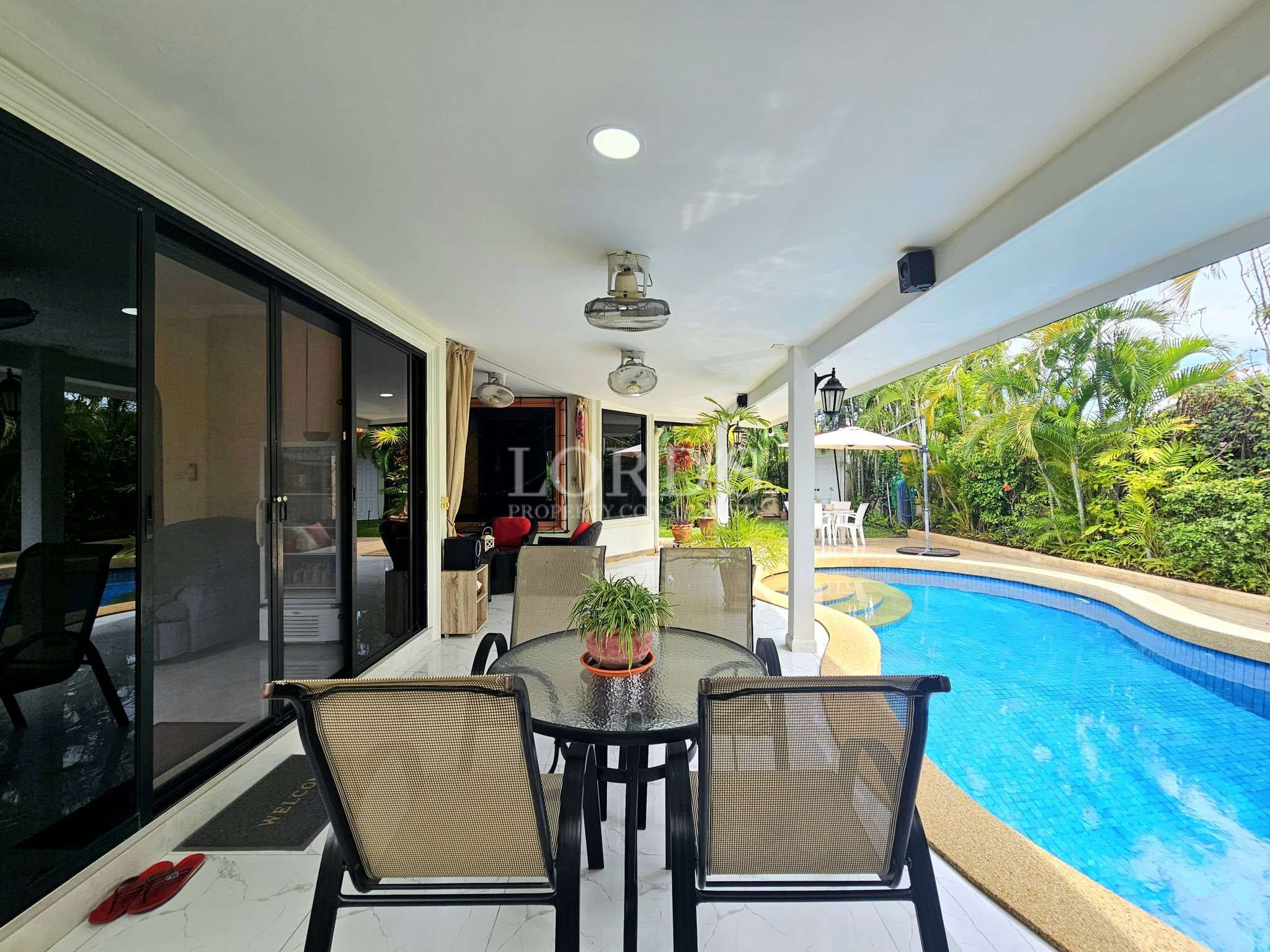 Modern patio with pool and greenery