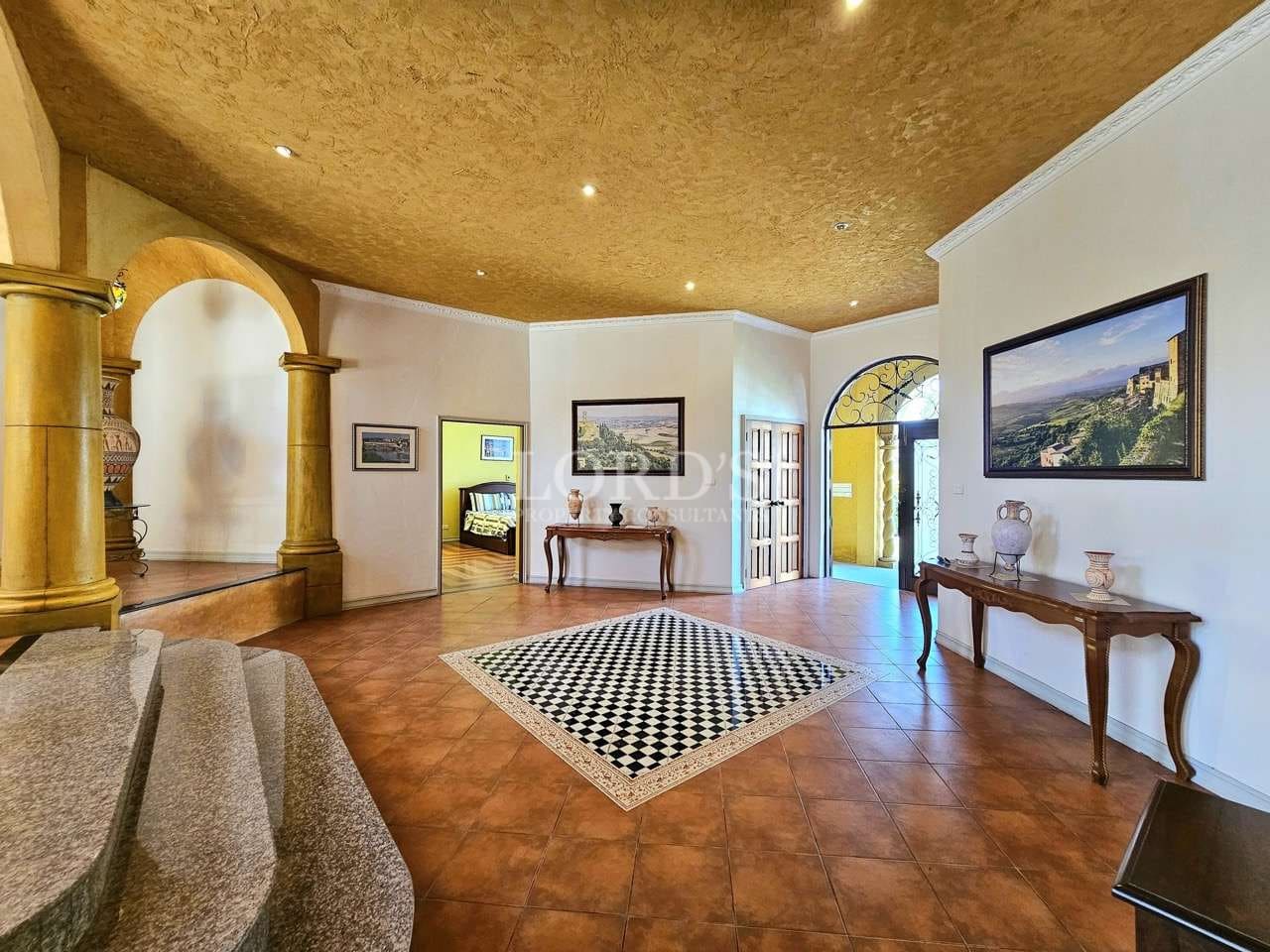 Spacious entryway with elegant decor.