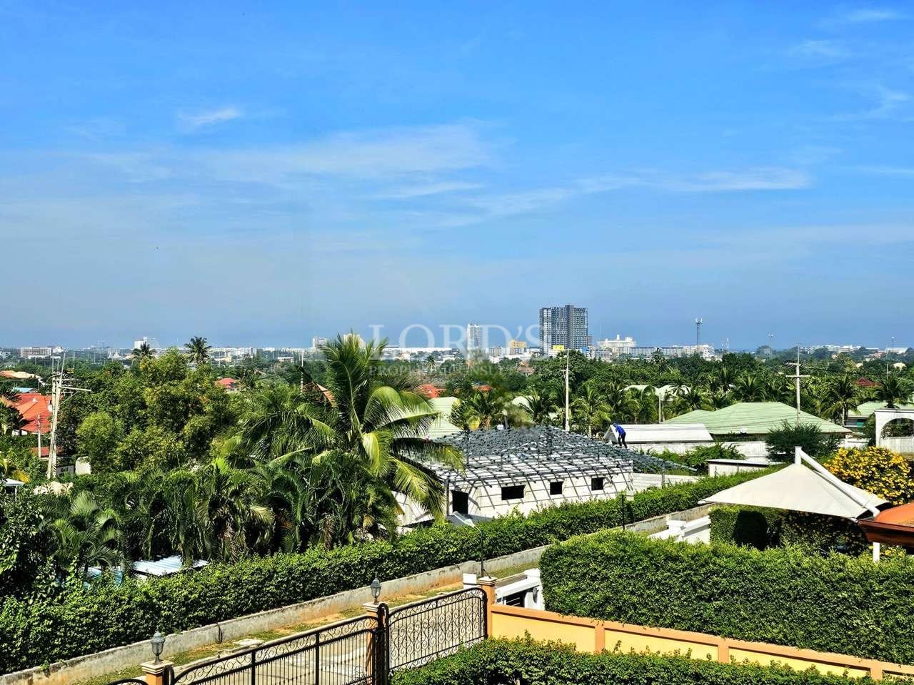 Lush greenery under a clear sky.