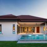 Modern house with pool at sunset