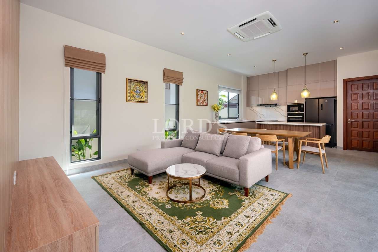 Modern living room with kitchen area