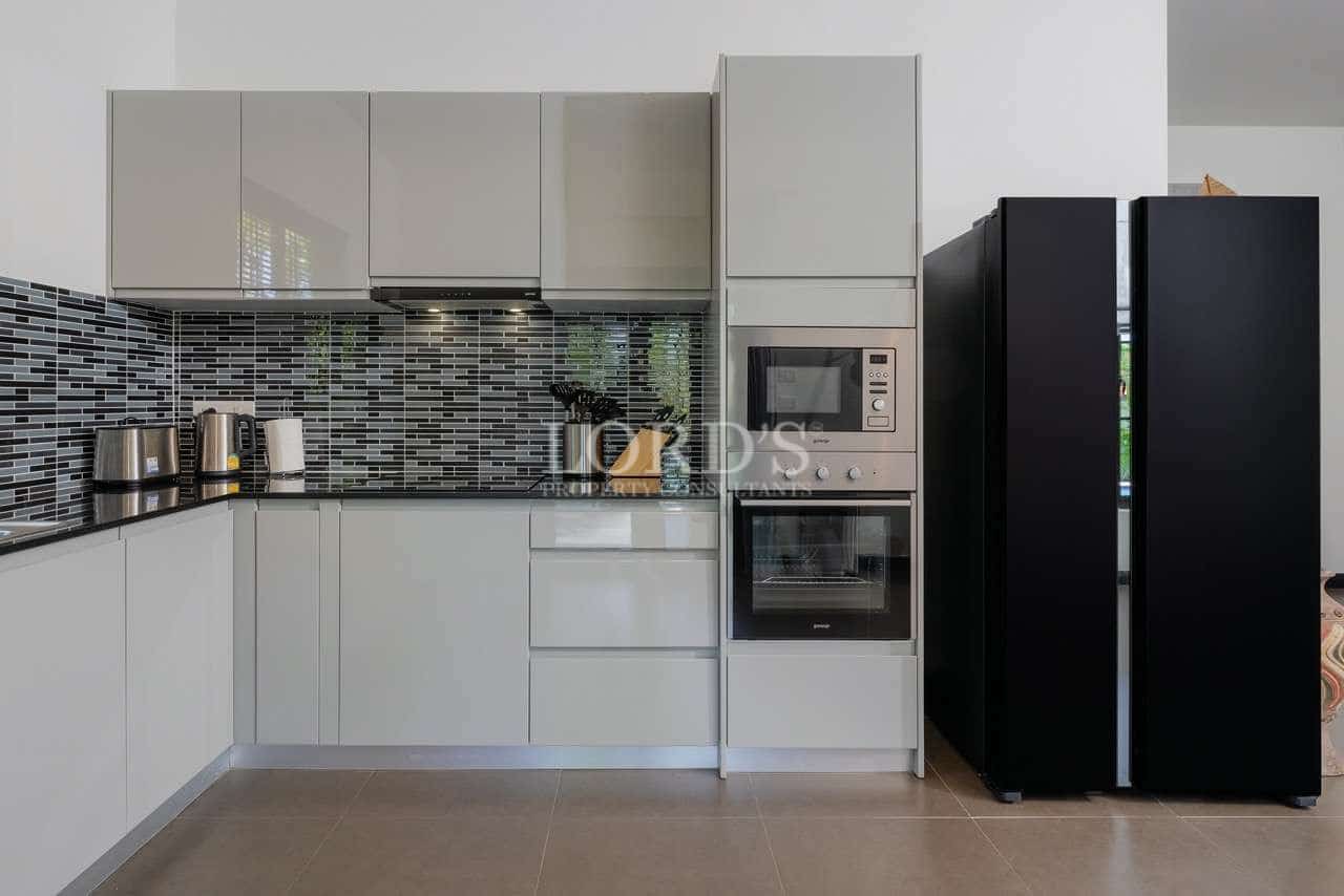 Modern kitchen with sleek appliances.