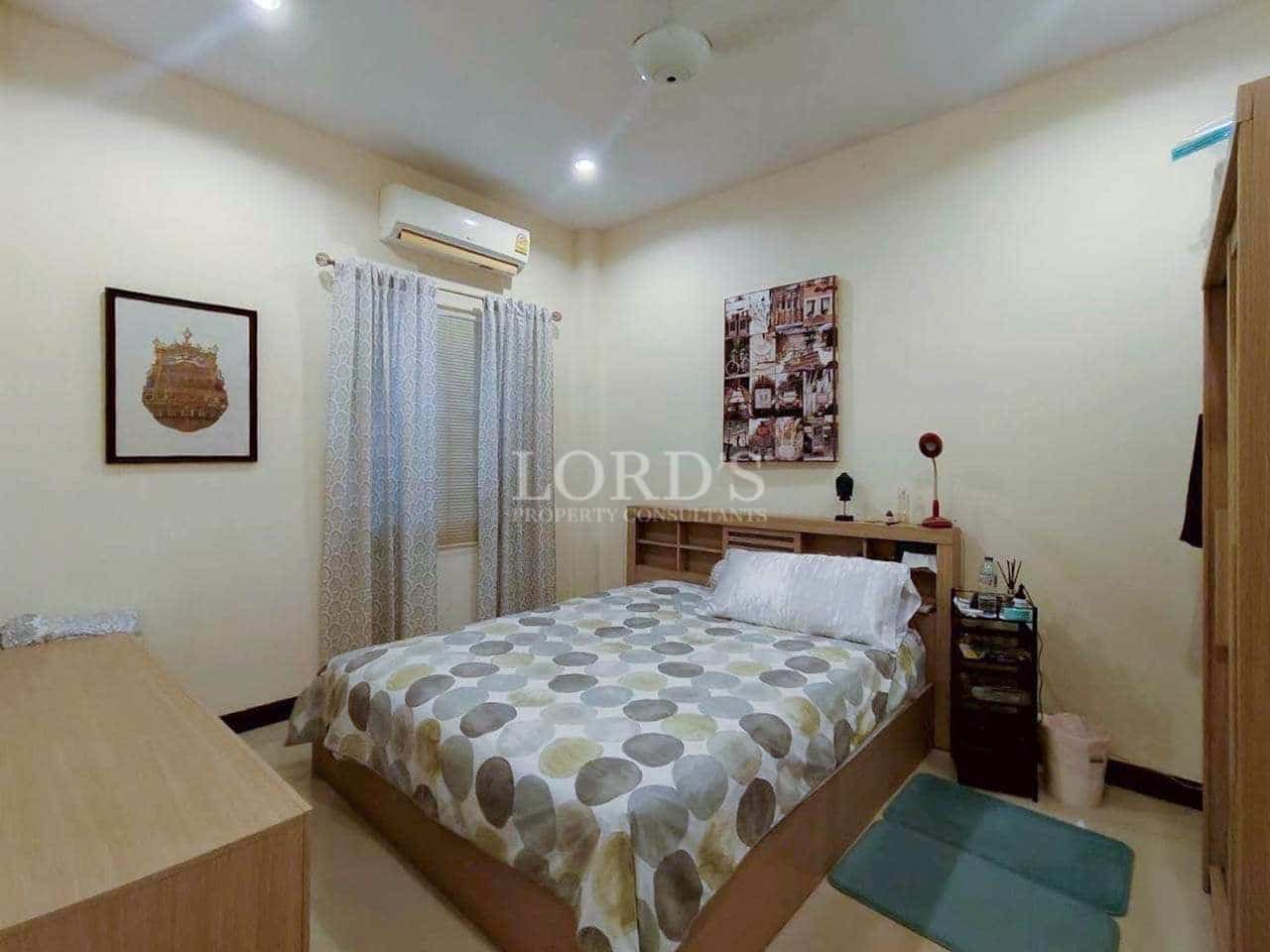 Cozy bedroom with patterned bedding.