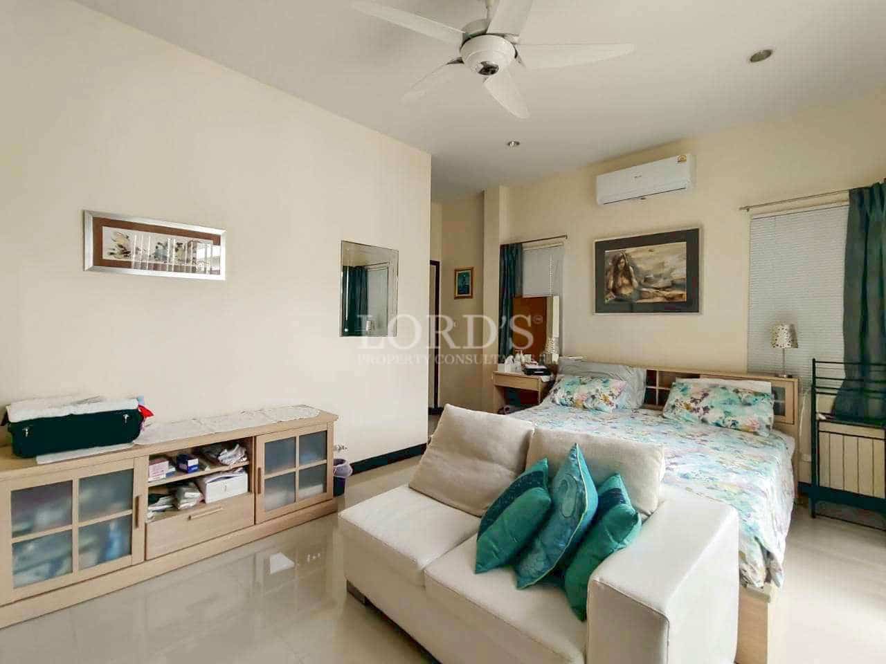 Cozy bedroom with modern furnishings.