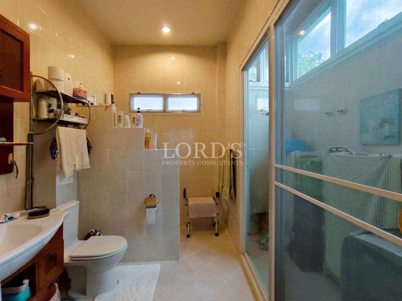 Spacious, well-lit bathroom with shower.