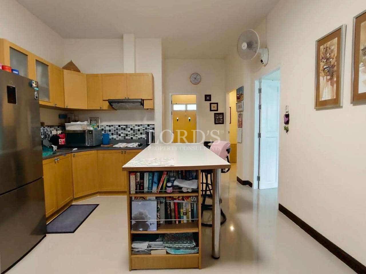Modern kitchen with wooden cabinets.