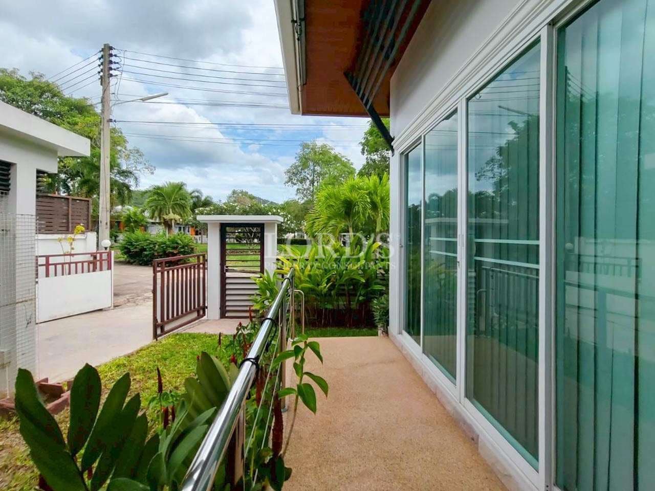 Modern house entrance with greenery.