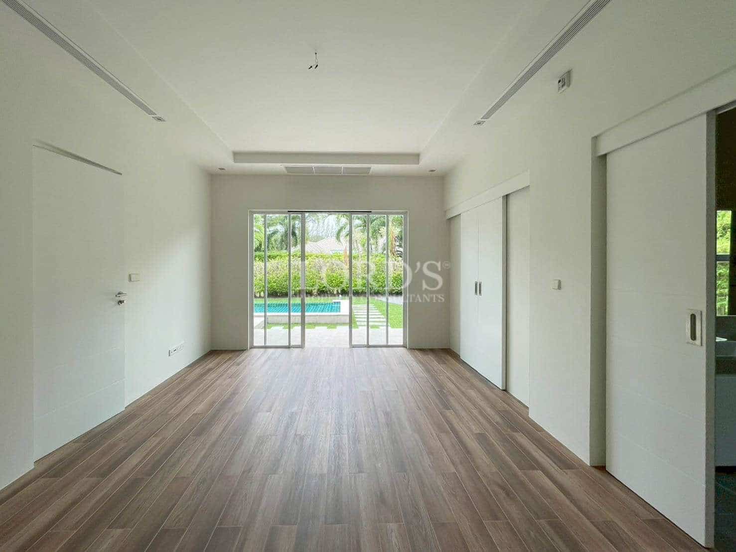 Empty room with large windows