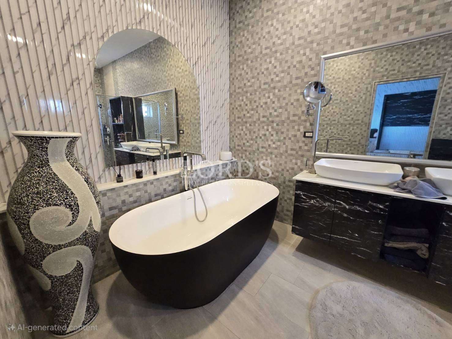 Luxury bathroom with freestanding bathtub, mosaic tile walls, modern vanity, and designer decor.