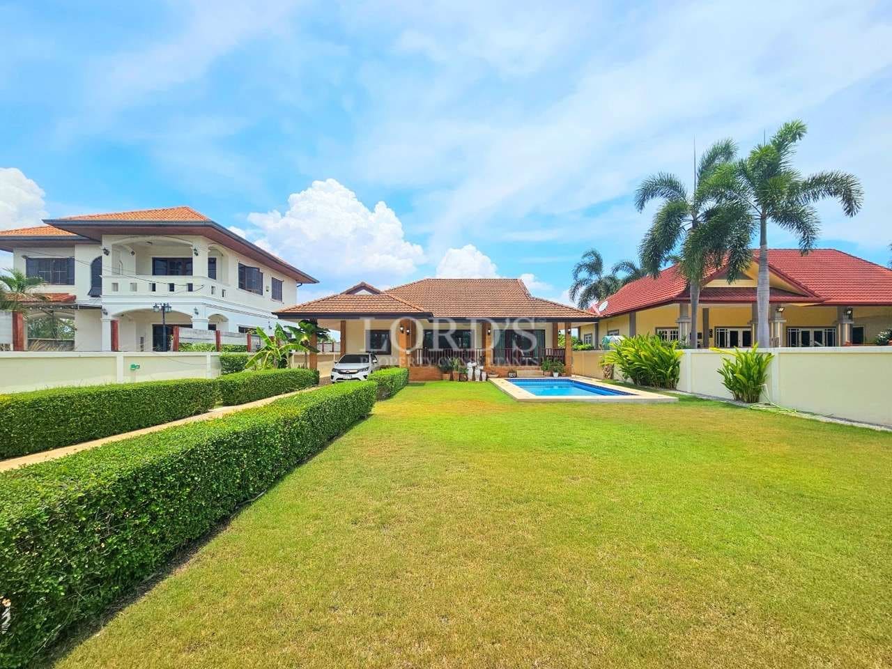 Spacious yard with houses and pool