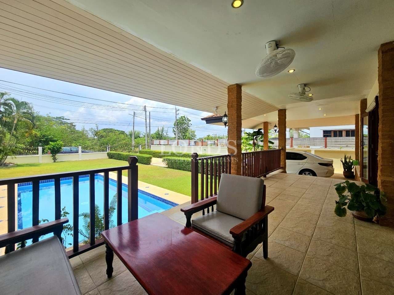 Porch overlooking pool and garden